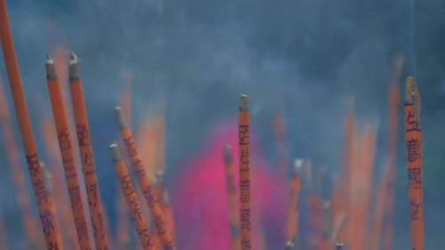 Incense Sticks are Burning Slowly in the Burner of a Chinese Temple