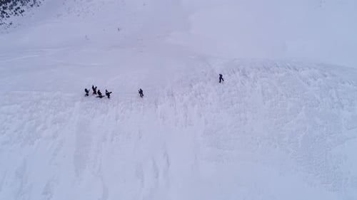 Fly over snowboarders