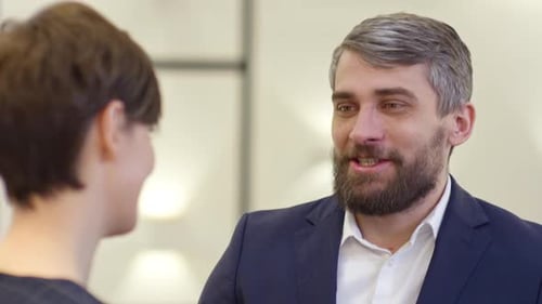 Smiling Entrepreneur Talking to Businesswoman