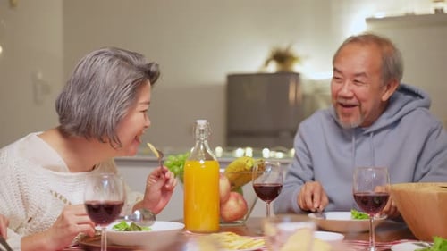 Friends and Family Toasting with Wine at Dinner