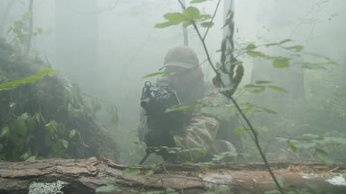 Soldiers Aiming Rifles in Foggy Forest