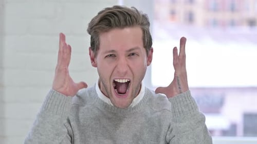 Man Expressing Frustration then Smiling