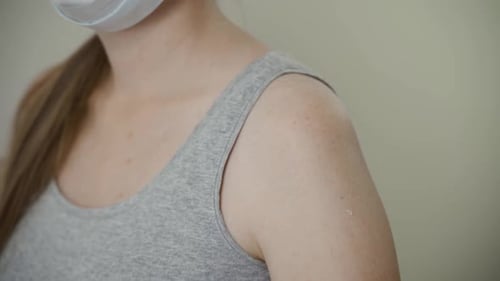 Woman Receives Vaccine Injection in Doctor's Office