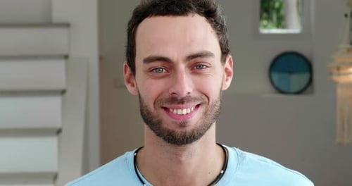 Confident Portrait of a Pleasant Positive Handsome European Guy in Casual Wear Standing at Home