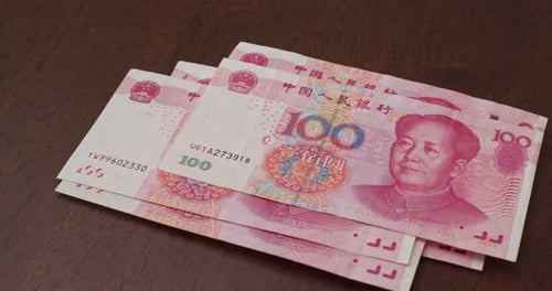 Close Up of Chinese Yuan Banknotes on Table