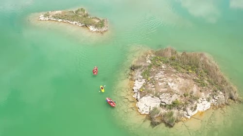 Group Of People Canoeing On The Lake On Aerial View