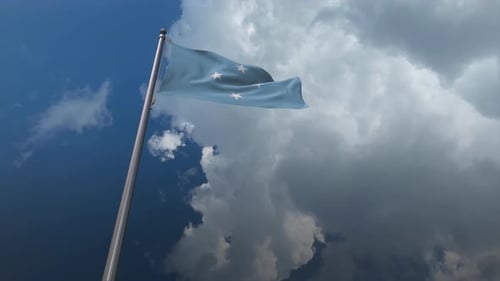 Waving National Flag Against a Dramatic Cloudy Sky