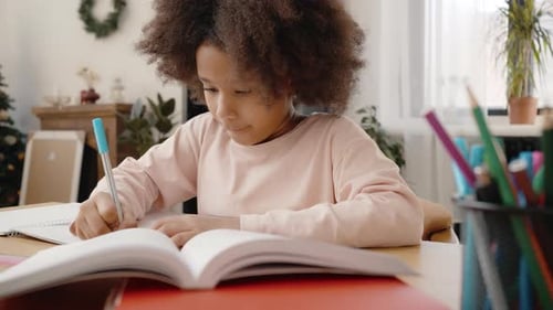 Girl Doing Homework at Table