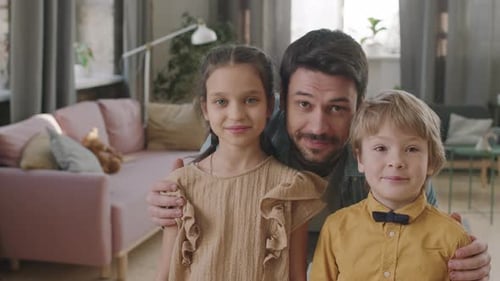 Affectionate Father Poses with Daughter and Son