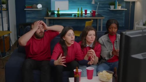 Friends Watch TV at Home and React Sadly