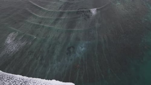 Aerial View of Ocean Waves and Coral Reef