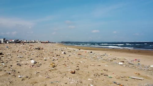 Plastic rubbish trash polluted on beach shore in rural Southeast Asia beach town
