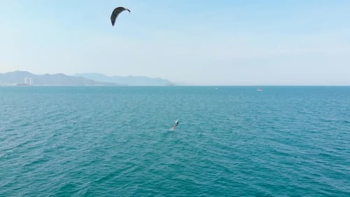 Aerial View of the City Beach and Active People Practicing Kite Surfing and Windsurfing. Kitesurfing