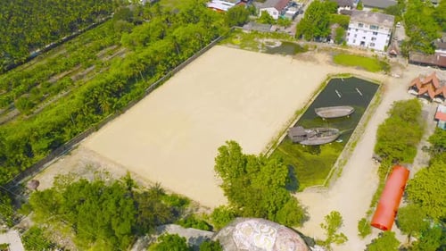 Aerial view of dry ground rough cracks in the land with sand in factory industry for construction