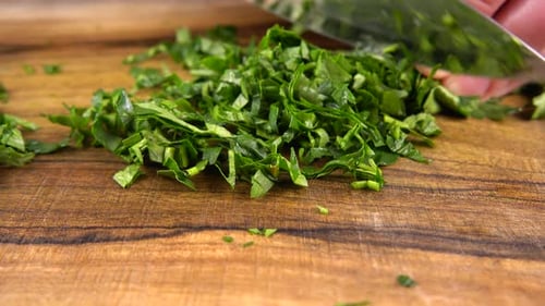 Close Up Person Chopping Fresh Green Parsley