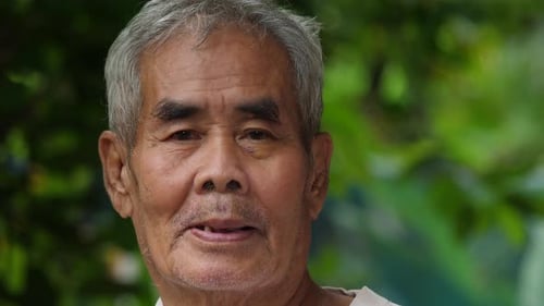 Close up Elderly man smiling in the park