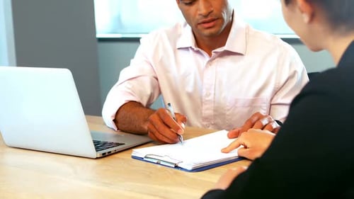 Business Meeting with Handshake at Office Workplace