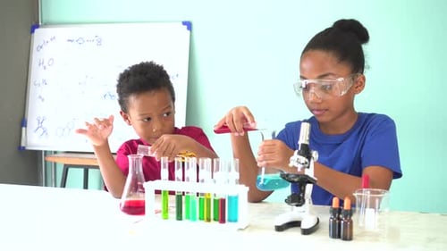 Children Performing Science Experiment with Test Tubes