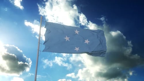 Micronesia Flag Waving against Blue Sky with Clouds