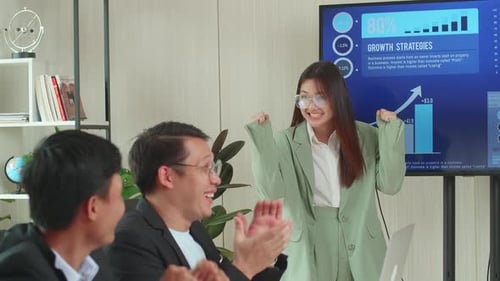 Young Woman Presents Growth Strategies to Colleagues