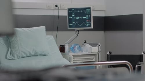 Nobody in Hospital Ward with Heart Rate Monitor and Bed