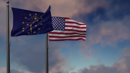 Waving Indiana and United States Flags Against Sky