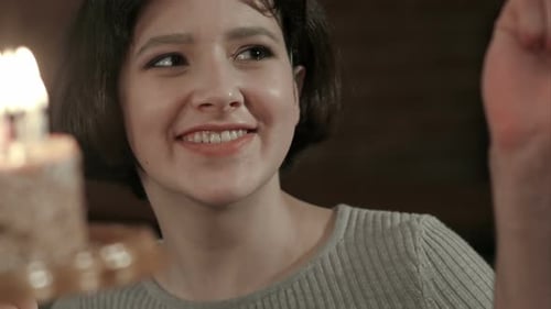 Happy Friends Birthday Celebrating with Candle on Cake in Club