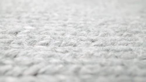 Extreme Detail View of Sheep Wool Cloth Texture Flowing in Macro Dolly Shot