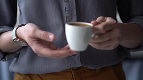 Anonymous woman with cup of fresh coffee