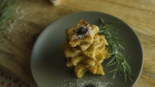 Star-shaped Pastries Stacked on Gray Plate