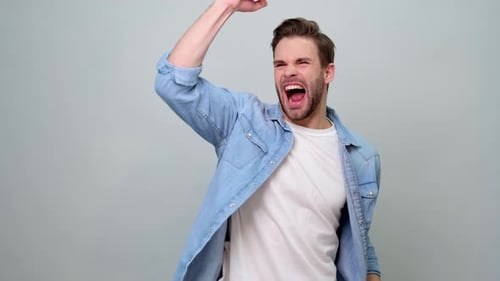 Excited Man Celebrating Success with Joy
