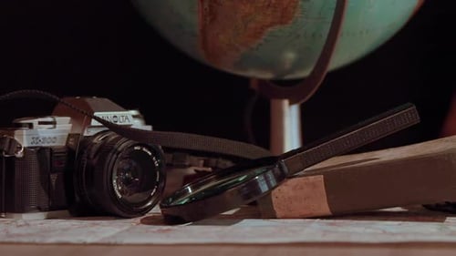 Travel Planning with Vintage Camera and Globe