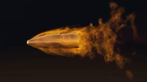 Slow motion shot of shooted bullet with fiery trail. Fire ammunition in slomo.