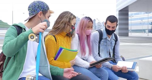 Diverse Students Study Together Wearing Face Masks