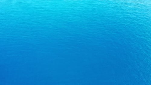 Luxury birds eye copy space shot of a white sandy paradise beach and turquoise sea background