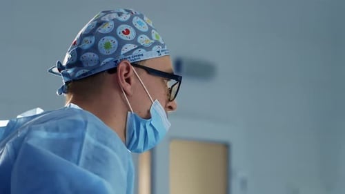 Medical Professional Wearing Surgical Cap and Mask