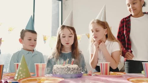 Children Celebrating Birthday, Blowing Out Candles