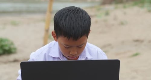 Rural Boy Studying From Computer