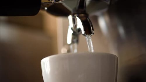 Espresso Machine Dispensing Liquid Into Cup