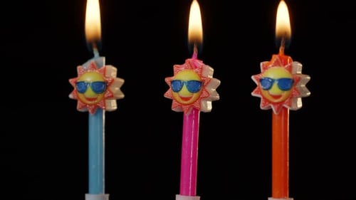 Burning Birthday Candles with Sun Design