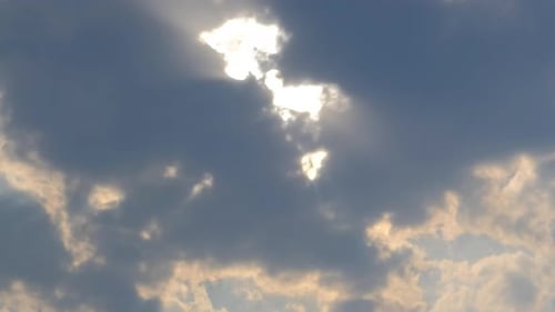 Sun Shines Through Clouds at Sunset