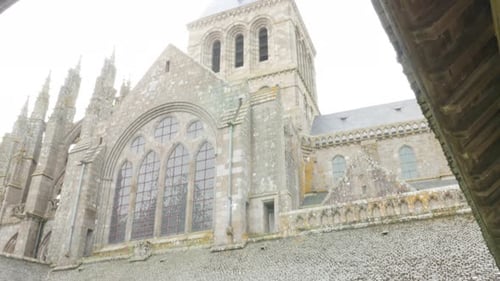 Mont-Saint-Michel island gardens located in french region of Normandy 4K 3840X2160 UHD slow tilt vi