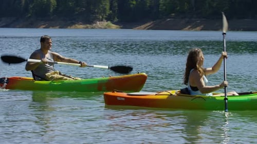 Couple kayaking in lake