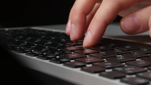 Both Hands of an Office Worker Typing on Keyboard, Front View, Close Up, Cam Moves To the Right