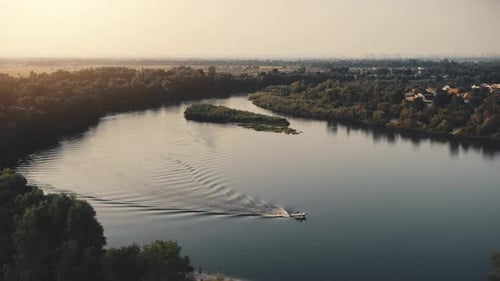 Aerial Sunset Landscape with Boat Sailing River Water