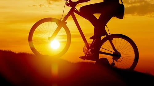 Cycling Mountain Climbing at Sunset