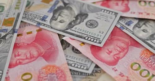 Close Up of American Dollars and Chinese Yuan