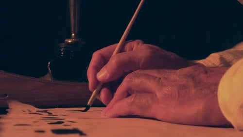 Arabic writing with ink on old paper.