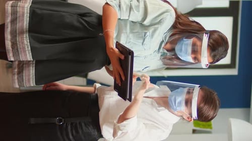 Women in Masks Working in the Office