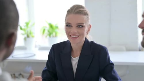 Close Up of Cheerful African Businessman Talking to Female and Male Business People